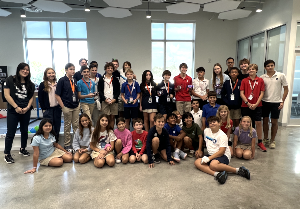 MCK+lower+school+students+pose+for+a+group+picture+with+students+from+the+Cybersecurity+Program.+During+the+Hour+of+Code+that+took+place+from+Dec.+6-8%2C+the+program+did+various+activities+with+the+younger+students.+One+activity+they+did+involved+drones+while+another+involved+computer-based+programs.+